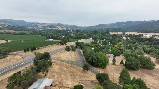 Aerial California Boonville city vineyard valley farms 1. Mendocino county, California. Grape, wine farm regions along Navarro River. Mountains, hills, valley and farming. Redwood and pine forests.