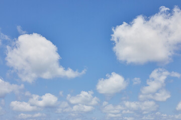 Naklejka na ściany i meble Background texture of blue sky with cumulus clouds