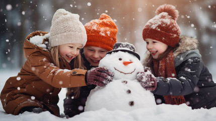 Children build snowman in falling snow