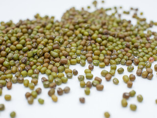 scattered green bean seeds isolated on white