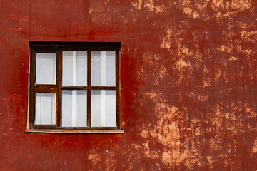 A window in an old abandoned building