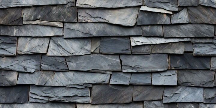 Slate stone roof in a seamless tiled pattern. Flat grey stone slabs create a repeating background texture.