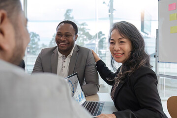 Horizontal close up photo focus aged attractive businesswoman boss in listen colleague ideas information at briefing meeting negotiation with business partners banner for website header design