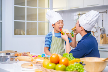 father and son cooking