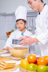 father and son cooking