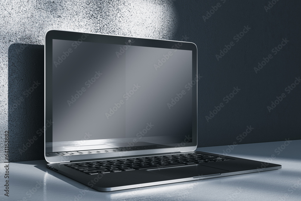 Aufkleber Close up of notebook computer with empty mock up screen placed on desk. Concrete wall with shadows in the background. 3D Rendering.