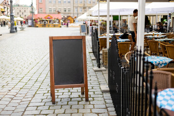 Restaurant sidewalk chalkboard sign board. Old Blak Signboard on the street. Blank store signage sign design mockup isolated