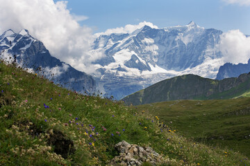 Fototapeta na wymiar Above the Lüschental Valley, with high Alpine peaks beyond: Bernese Alps, Switzerland