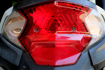 Detail of a modern motorbike taillight with red light