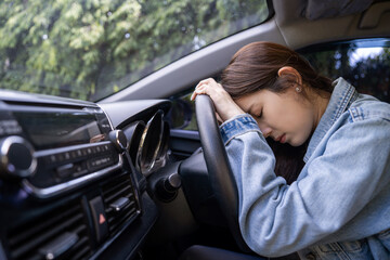 Tired young woman sleep in car, Hard work causes poor health, overworked concept