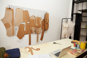 Photo of tailor working studio 