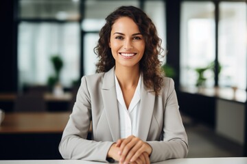 Happy mid aged business woman manager at office. Corporate leader, bank or insurance agent, lawyer, accountant, successful woman, leader manager looking at camera.