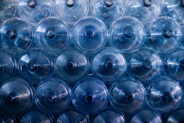 Plastic bottle or tank for drinking water in production line of factory. Process of filling water...