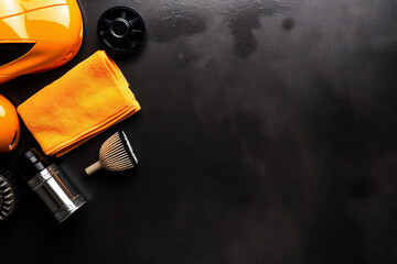 Top view of cleaning supplies and tools for car detailing