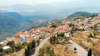 Fototapeta na wymiar Delphi, Greece. Modern tourist city. Sunny weather, Summer, Aerial View
