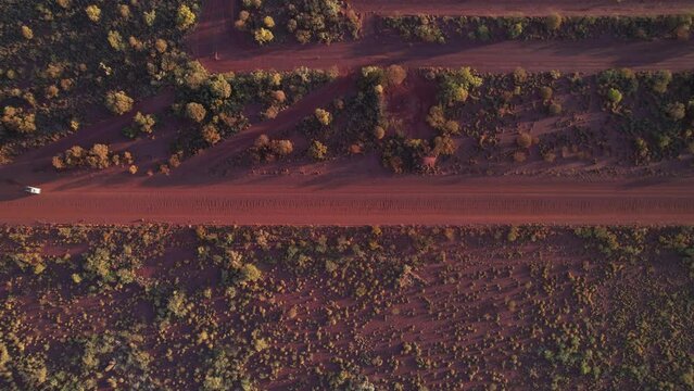 Driving along a red dirt road in outback Australia