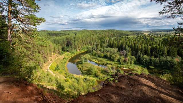 Beautiful view from the mountain to the Siberian forests on a sunny day. Udmurtia. Russia.