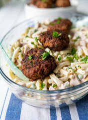 Traditional german meatballs or frikadellen with pasta salad