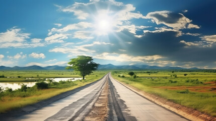 Fototapeta na wymiar Beautiful summer landscape with road, fields and blue sky with clouds