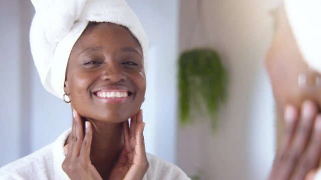 Skincare, face and cosmetic cream of an happy woman using facial beauty products for morning self care. Female with a smile health and wellness in a home bathroom.