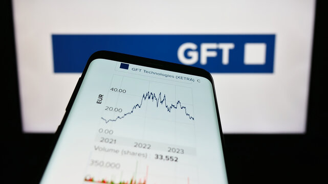 Stuttgart, Germany - 08-21-2023: Mobile phone with website of German IT company GFT Technologies SE on screen in front of business logo. Focus on top-left of phone display.