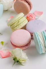 Top view Set Beautiful colorful French macaroons and flowers. Spring Flat lay white background