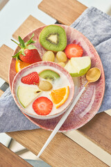 Mix of fruits and berries with yogurt