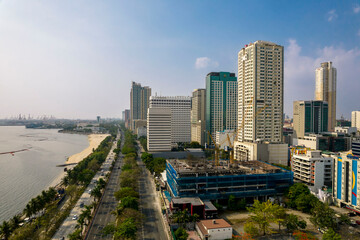 Fototapeta premium Manila, Philippines - Afternoon aerial of Manila skyline showing the dolomite beach in Manila bay and promenade along Roxas Boulevard.