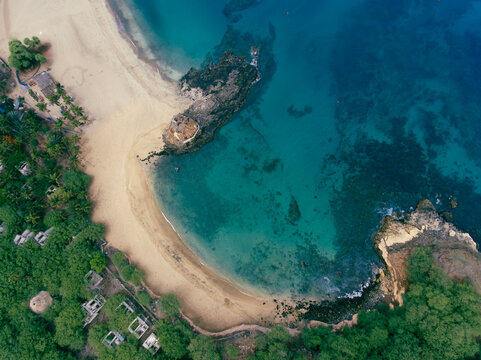 Aerial drone Tarrafal in Santiago Island, Cabo Verde showcase golden beaches, azure waters, and rugged mountains, it's a paradise for nature lovers. The charming town, historic sites