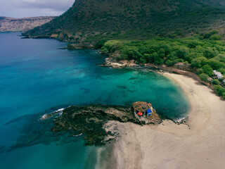 Aerial drone Tarrafal in Santiago Island, Cabo Verde showcase golden beaches, azure waters, and rugged mountains, it's a paradise for nature lovers. The charming town, historic sites