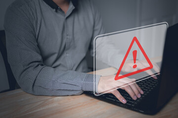 Computer hack warning,System hacked warning alert on notebook (Laptop),cyber security concept,The danger of malware viruses,ransomware virus,triangle caution warning sign notification error