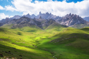 Pointed stone peaks in the dolomite mountains, on a summer day in the Kelinshyktau Mountains, the...