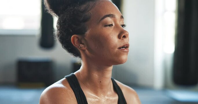 Tired, sweating and breathing with woman in gym for fitness, workout and health. Exercise, fatigue and performance with face of person thinking for wellness, training and sports club challenge