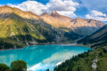 Big Almaty Lake in Tien Shan mountains of Kazakhstan. Beautiful mountain landscape on a summer evening