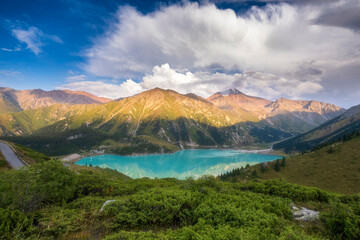 Big Almaty Lake in Tien Shan mountains of Kazakhstan. Panorama of Beautiful mountain landscape on a summer evening