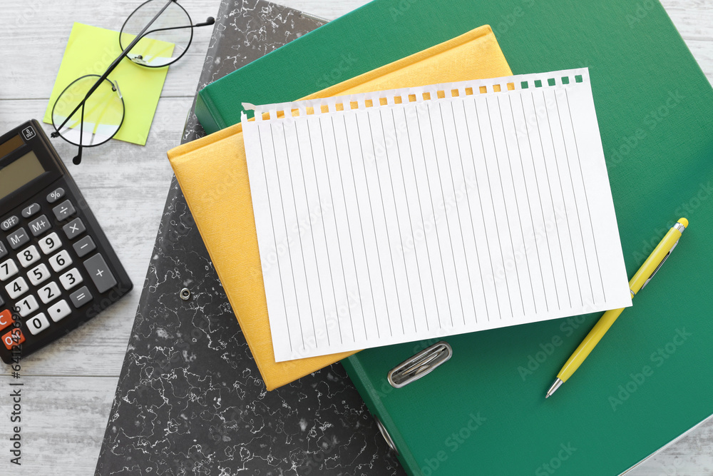 Poster notepad, green folder calculator. mockup on office background for copy space. it is important not to