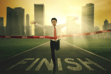 Businessman on the finishing line in 2023 business competition