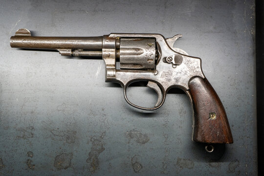 Old revolver Smith and Wesson Firearms Co. Firearm pisto. Vintage classical gun closeup. Poland, Warsaw - August 31, 2023.