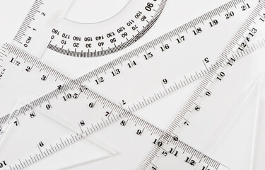 school background with set of transparent rulers on white background