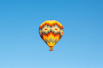 Hot air balloon in the blue sky. Cappadocia, Turkey
