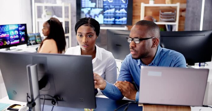 African Financial Data Analysts Using Dashboard On Screens