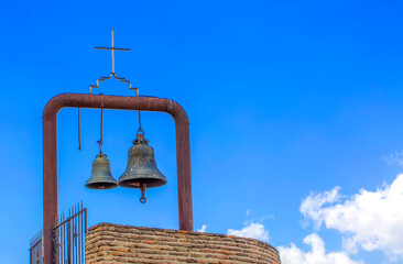 Orthodox bell tower and bell in the old church