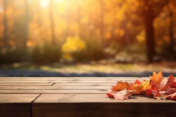 Naklejka na ściany i meble Wooden table with autumn leaves