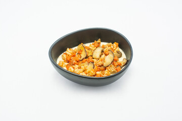 Steamed egg with shrimp , mushroom and carrot in black bowl isolate on white background