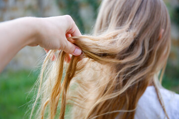 The child has uncombed hair.