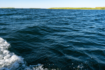 blue water body in a lake with a small waves in
