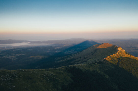 Pyramid shape shade of Rtanj mountain peak on sunrise	