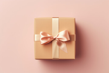 A gift box wrapped in cream paper and tied with a gold ribbon