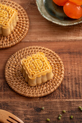 Delicious Cantonese moon cake for Mid-Autumn Festival food mooncake on wooden table background.