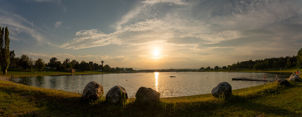 Lake schwarzl sunset panorama schwarzlsee near the styrian capitol graz in austria. View at surrounding mountains. Sunny day in Summer. Recreation